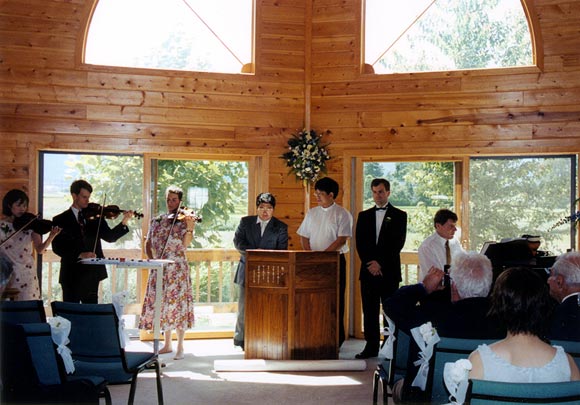 Violin trio bringing in the wedding party and bride
